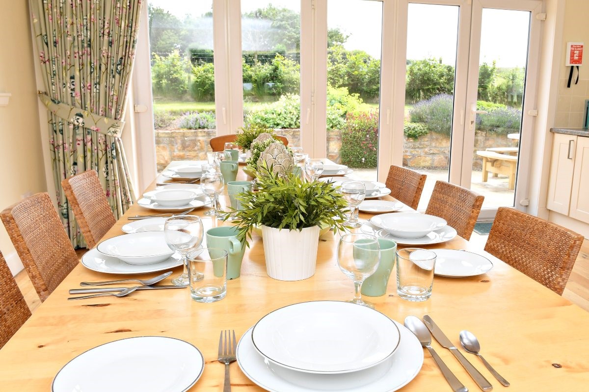 Hawthorn House - large dining table in the kitchen, perfect for gathering around to enjoy a delicious meal