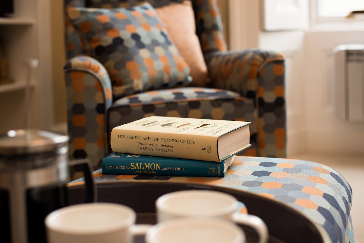 The Linen House - a separate sitting room offers a perfect spot for some quiet time with a good book