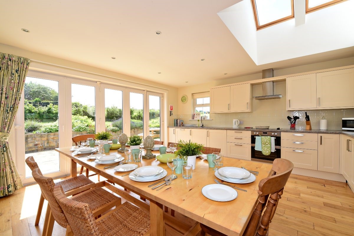 Hawthorn House - bright and airy kitchen with large bi-fold doors out to the garden and skylight