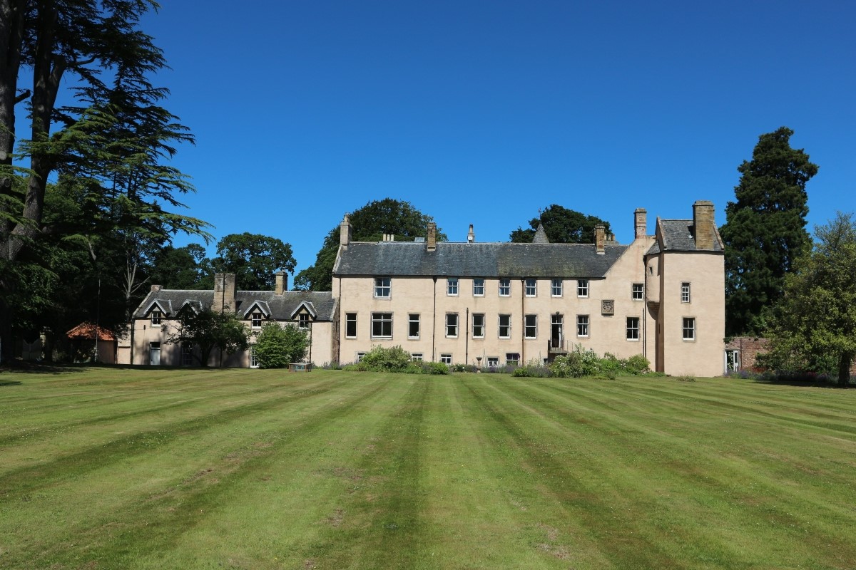 The Tower, Keith Marischal - the rear aspect of the main house, with The Tower on the far right of this image and extensive lawned grounds