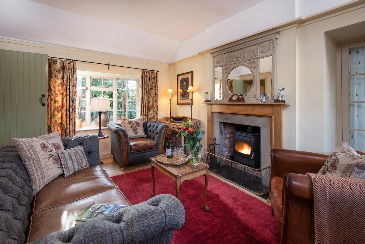 The Cottage - cosy sitting room with Harris Tweed and wood burner