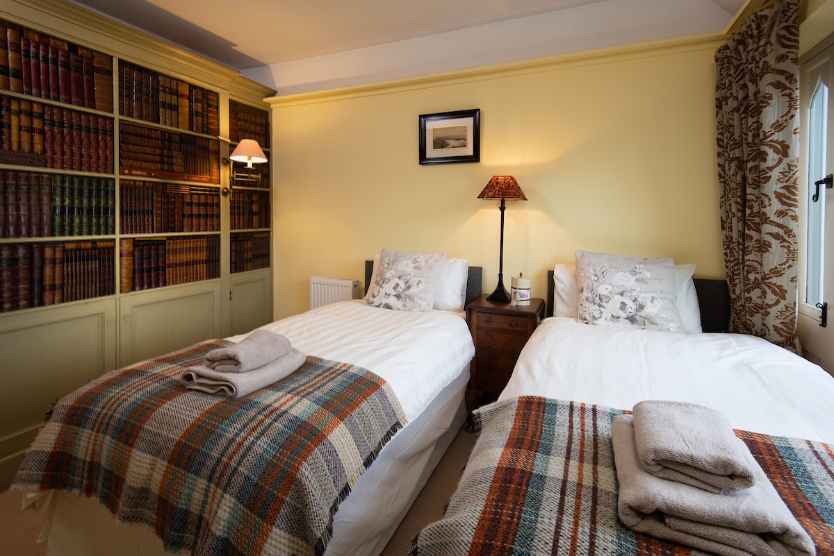 The Cottage - bedroom two with twin beds (1)