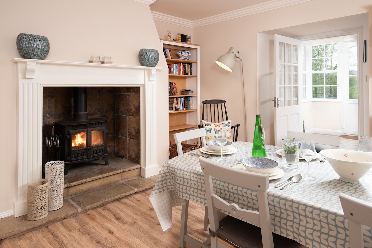 Berryburn Cottage - wood burning stove in the kitchen dining area