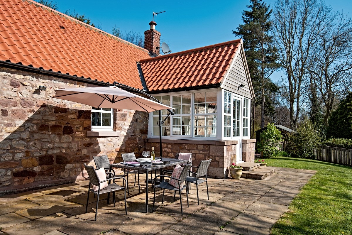 Berryburn Cottage - sunny patio area with garden furniture