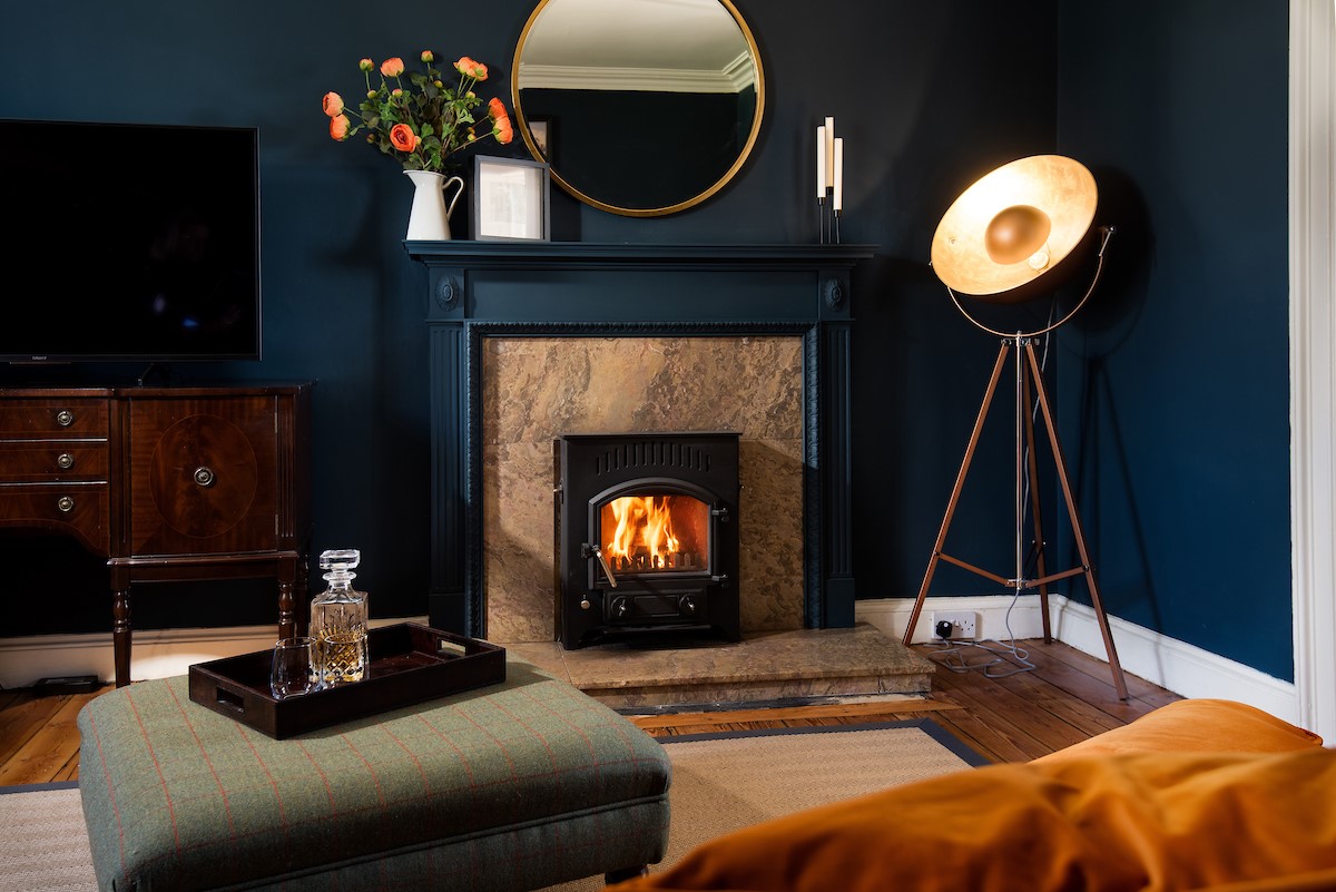 Cairnbank House - enjoy the cosy feel of the snug/sitting room with wood burning stove and TV