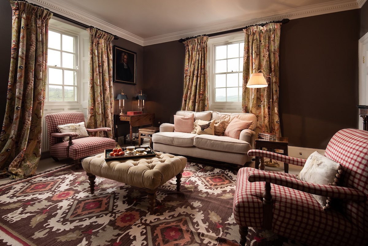 Broadgate House - cosy sitting room with sofa and armchairs