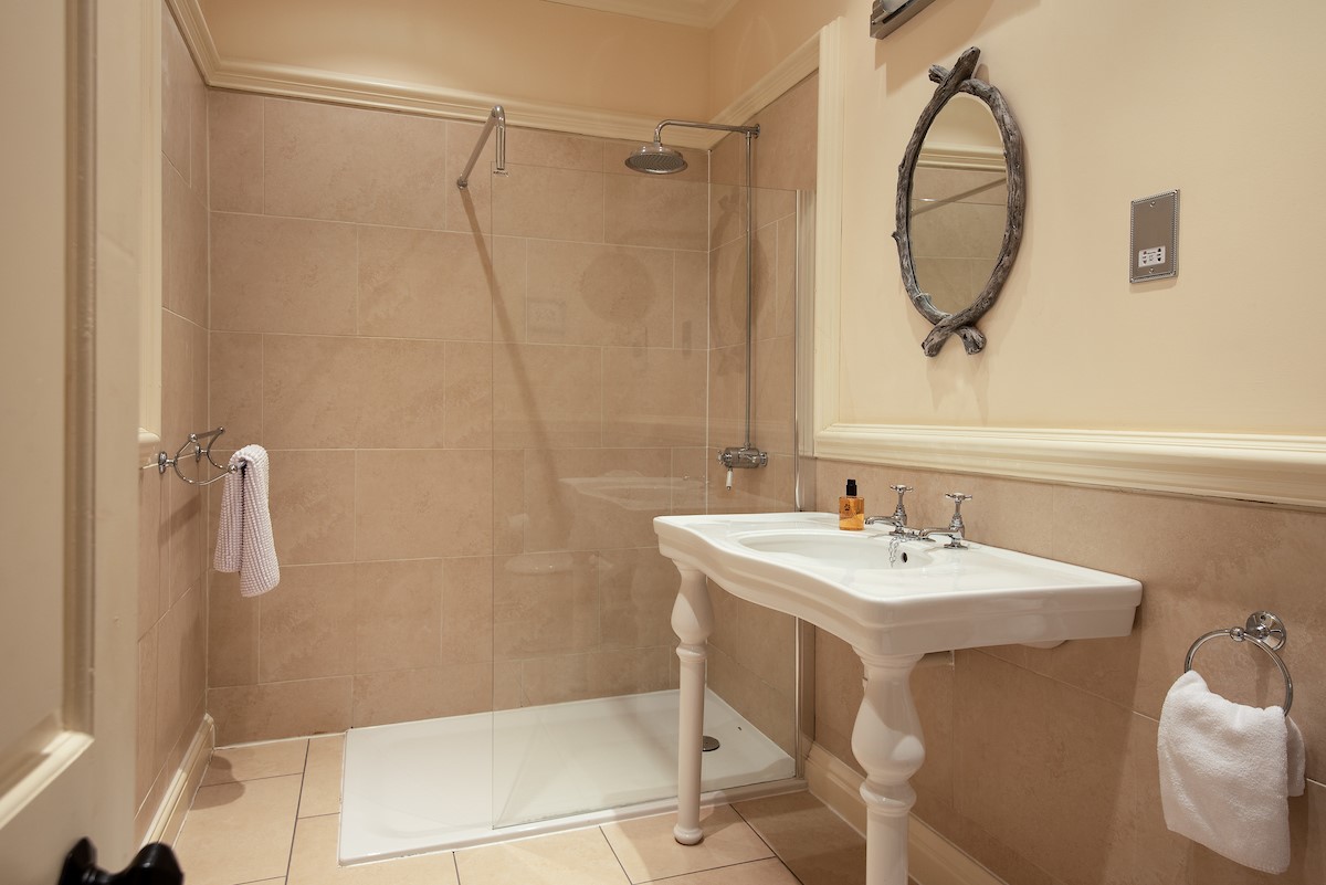 Eslington East Wing - bedroom five en-suite shower room containing walk-in shower with rainforest shower head