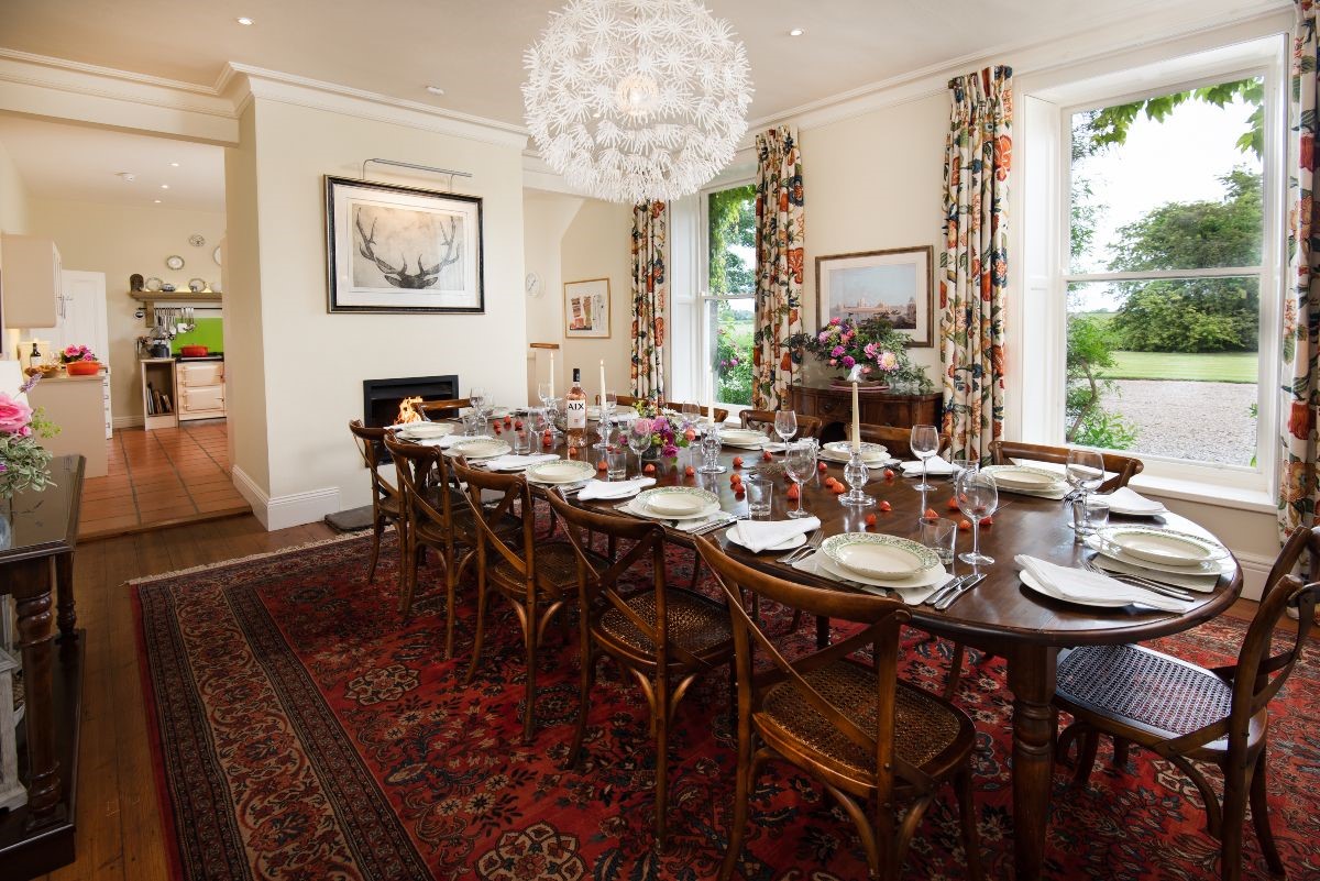 Brunton House - dining room with seating for 16 guests leading through to the kitchen