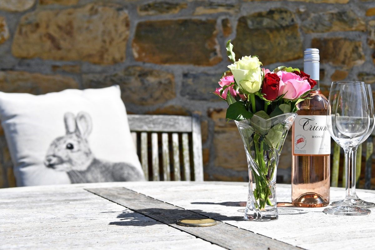 Fordel Cottage - the perfect suntrap in the garden to sit back and enjoy a refreshing drink