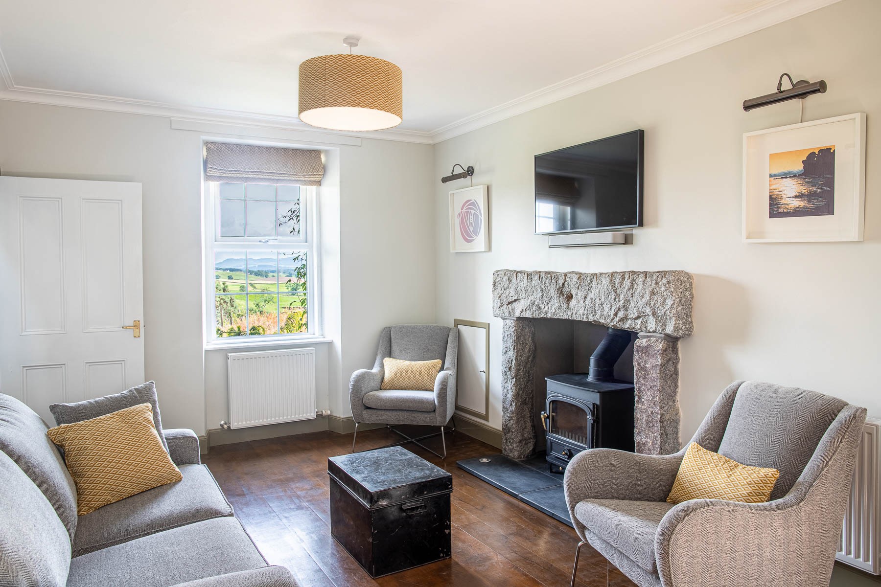 Culdoach Cottage - open plan living space with log burner, TV, and comfortable seating