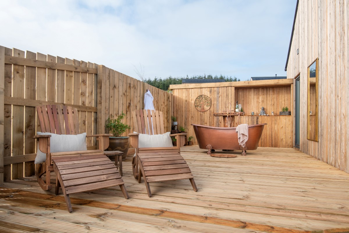 The Elm - decking area with Shaanti Bath and wooden loungers