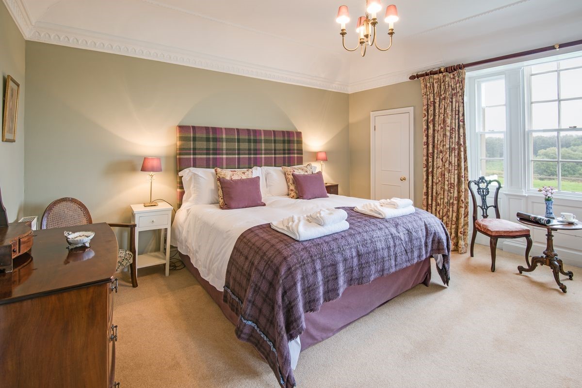 Abbey House - bedroom one with super king bed and views over the River Tweed