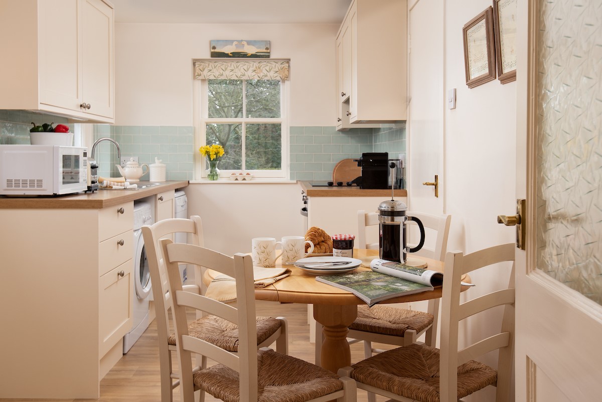 Daffodil Cottage - the kitchen with dining space for four guests