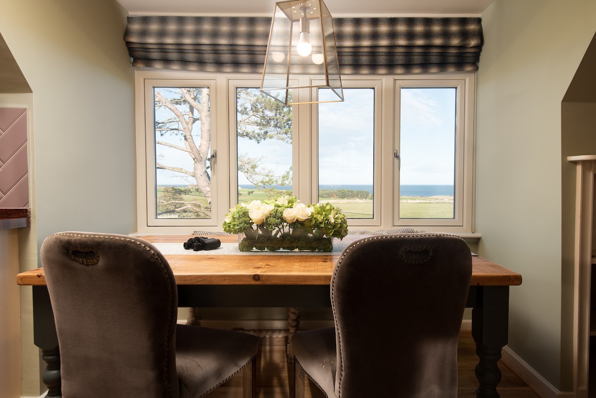 Captain's Landing - dining table with seating for four guests