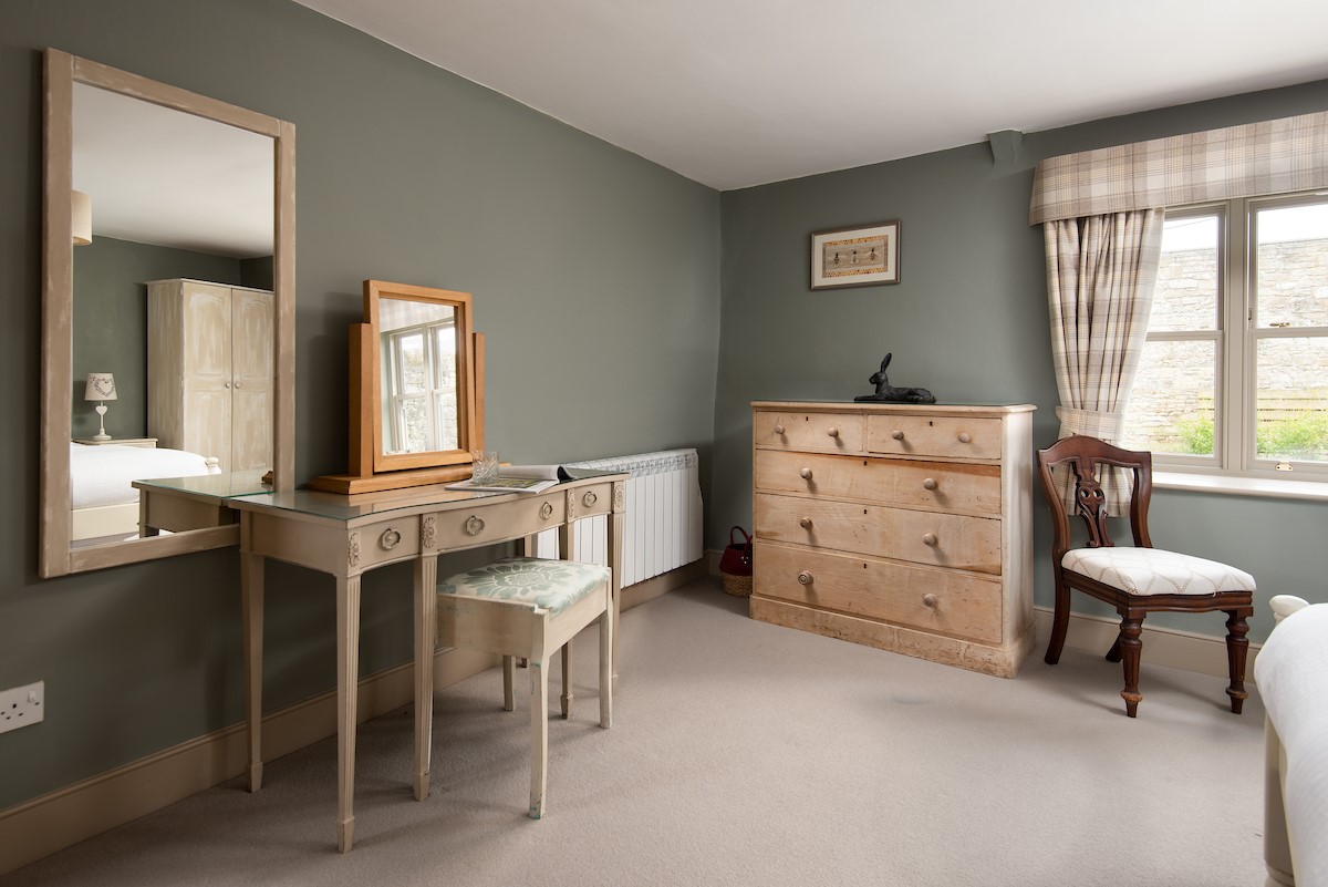 Bee Cottage - chest of drawers, dressing table with stool and large mirror in bedroom one