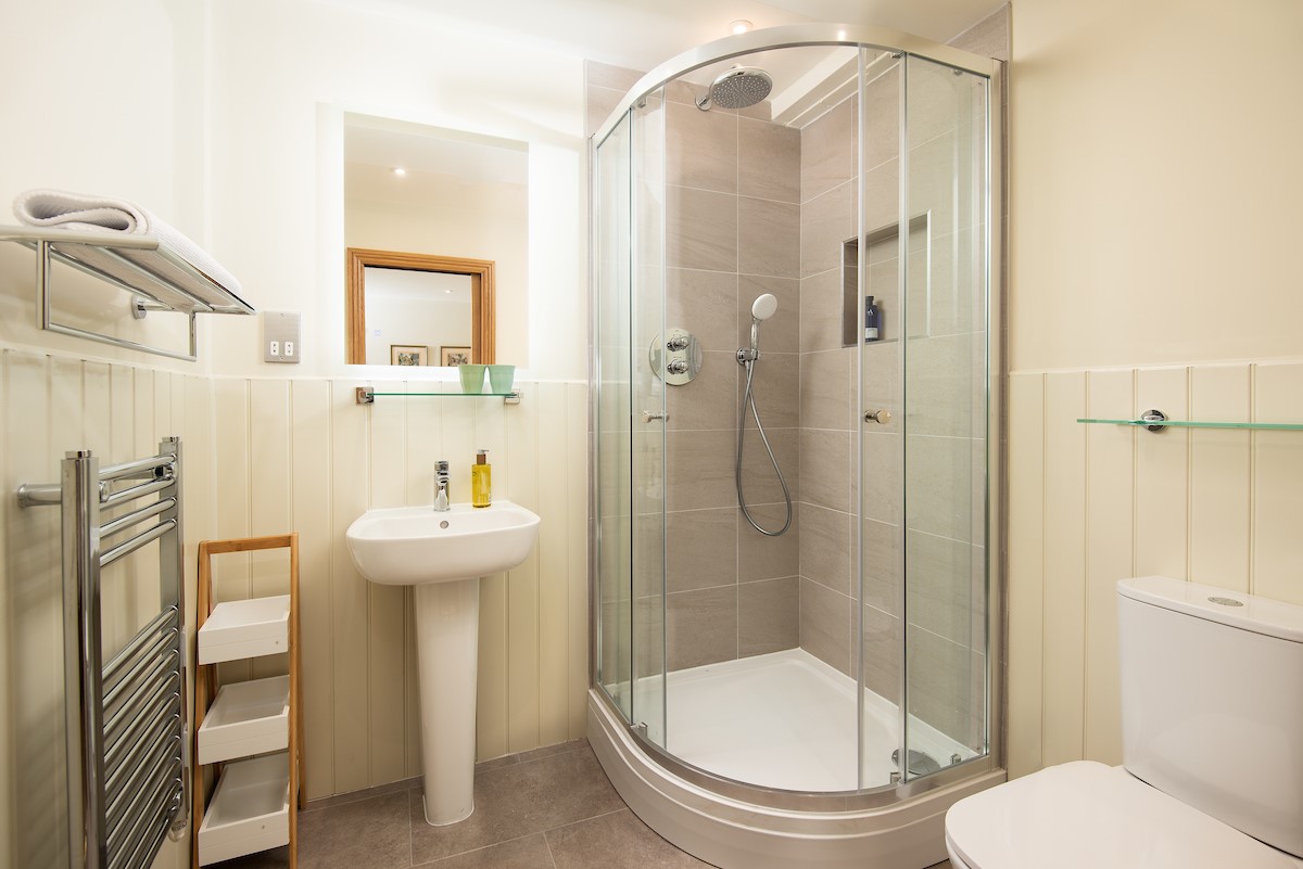 Old Granary House - en suite of bedroom one featuring a corner shower with rainforest head and separate mixer