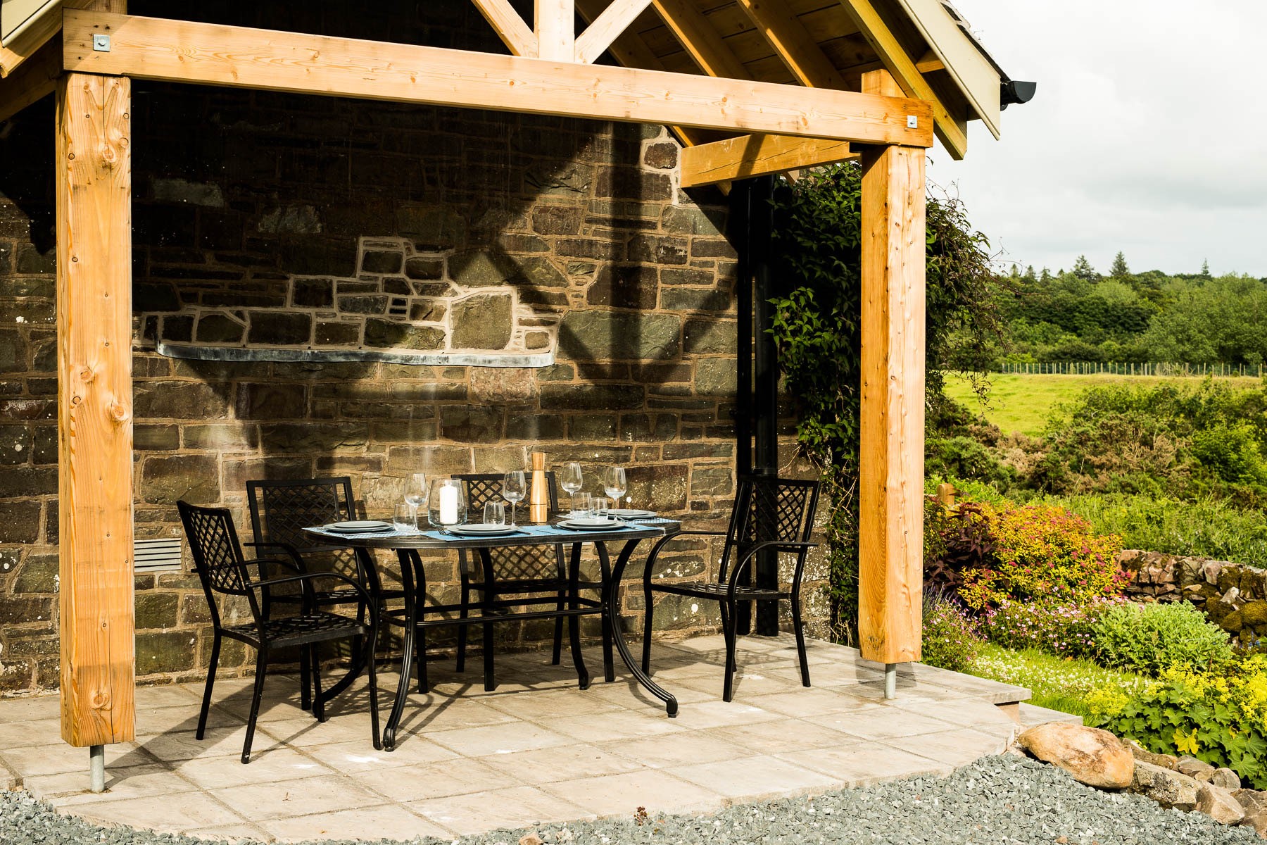 Culdoach Cottage - enjoy alfresco dining on the sheltered patio with views across the estate