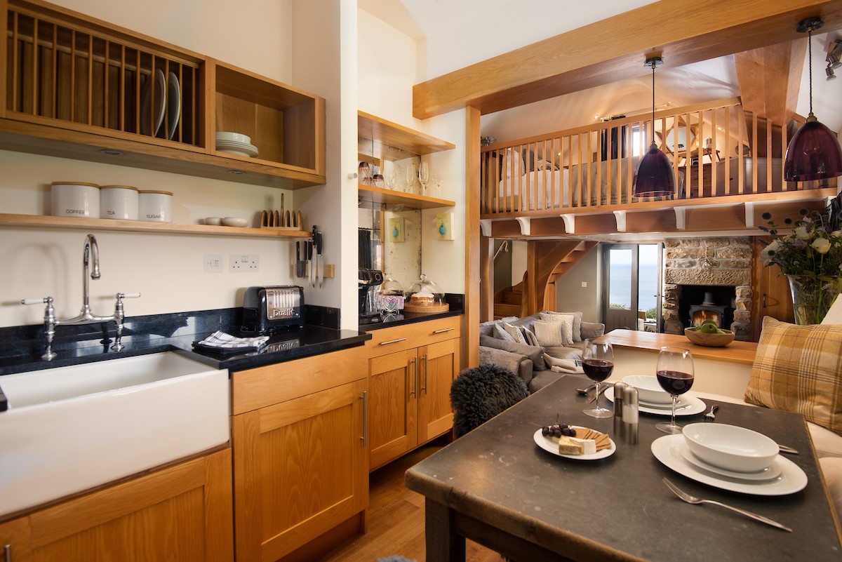 Bay View Cottage - the fully fitted kitchen with ample dining space for up to four people