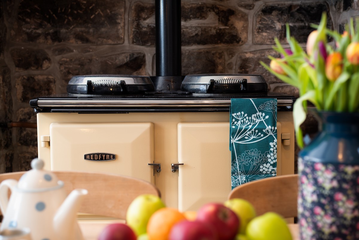 Appletree Cottage - the AGA brings warmth to the kitchen and ideal for rustling up a tasty casserole too