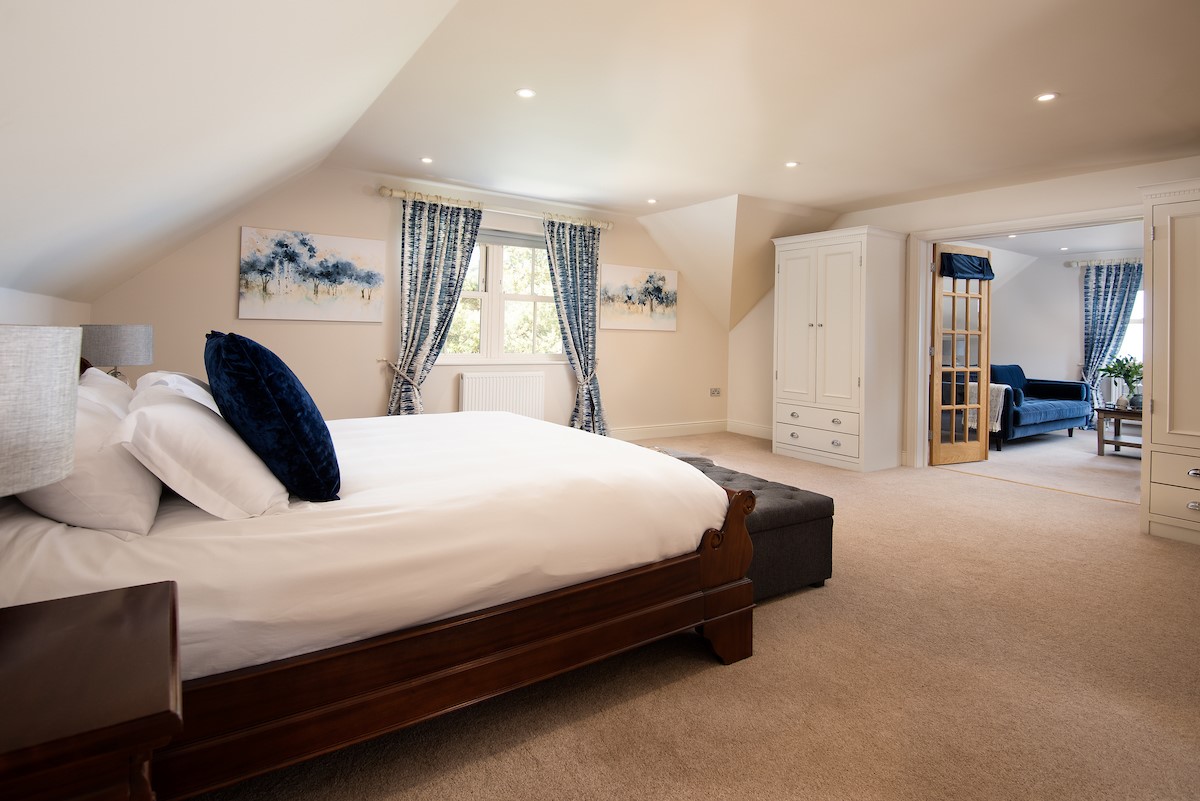 Bracken Lodge - bedroom three is a spacious with separate private sitting room through the double doors