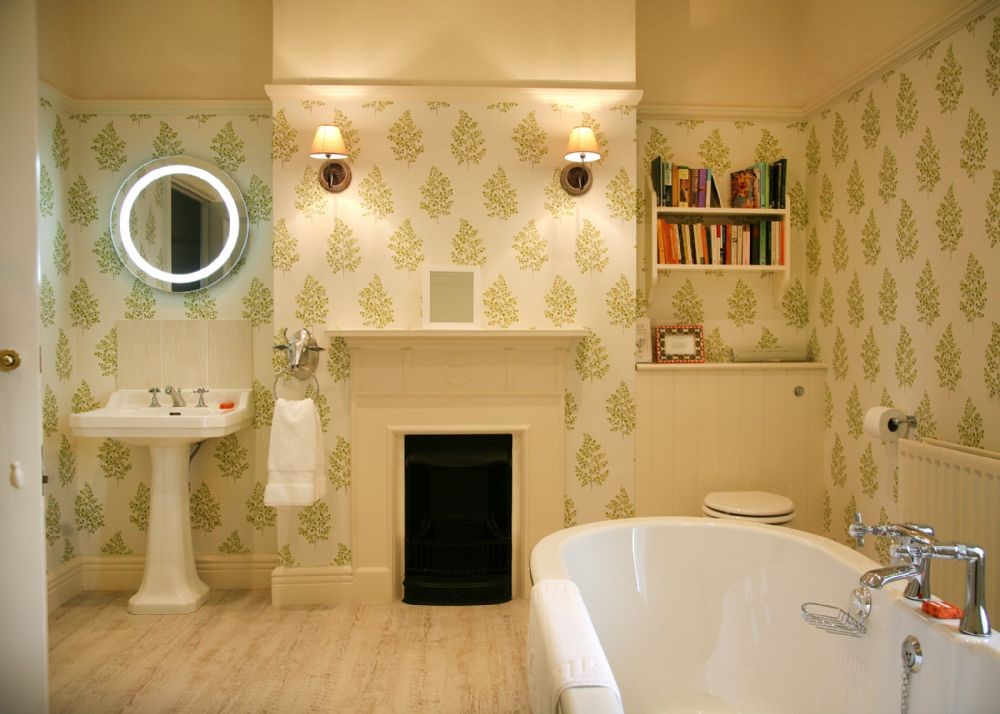 Brunton House - large bathroom three with roll-top bath, decorative fireplace, WC and basin