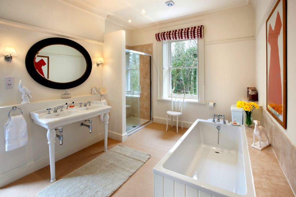 Brunton House - bathroom one with double basins, walk-in shower, WC and bath