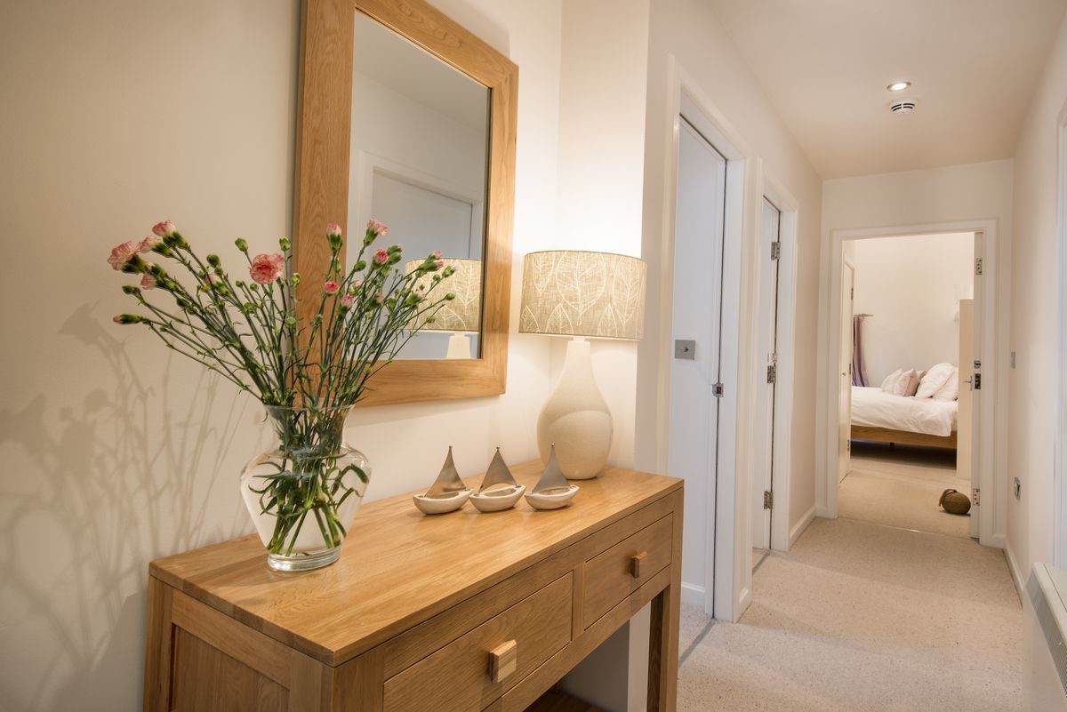 Budle Bay Loft - hallway with console table and access to bedrooms