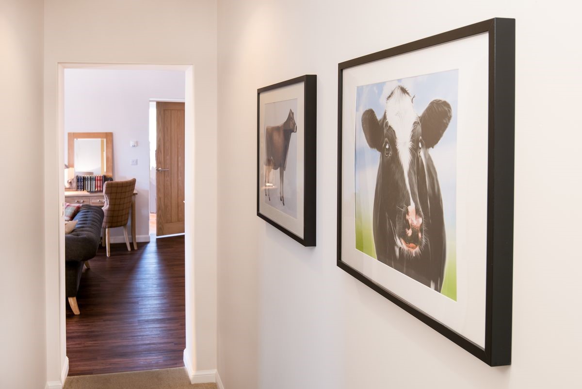 Byre - hallway with farm-themed artworks
