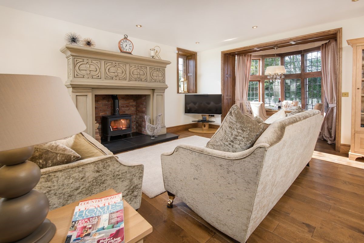 Captain's Rest - snuggle up and watch TV in front of the wood burning stove