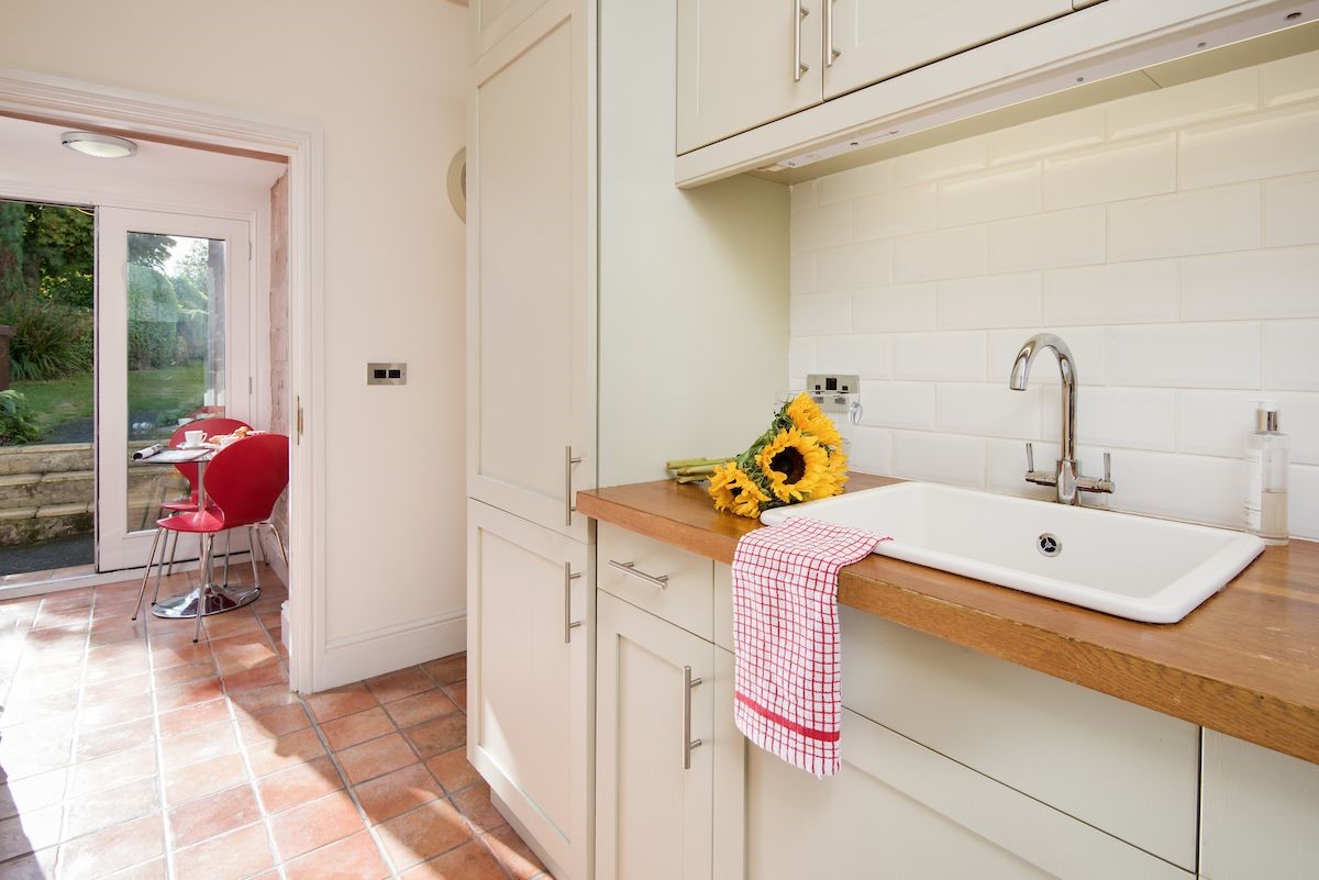 Captain's Rest - the bright kitchen with access to the garden area