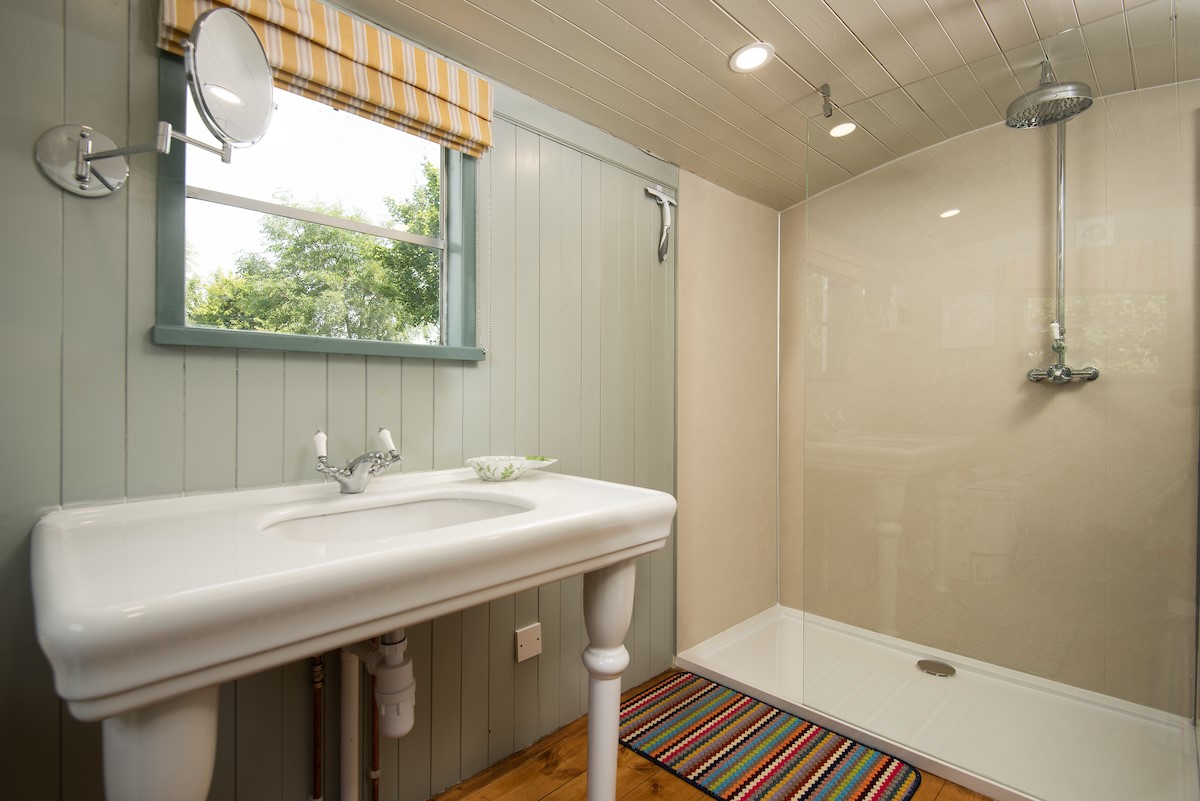 The Showman's Wagon - adjacent private bathroom with large walk in shower, basin and WC