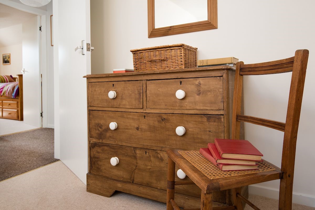 Coldstream Coach House - chest of drawers in bedroom one and door leading through to the landing