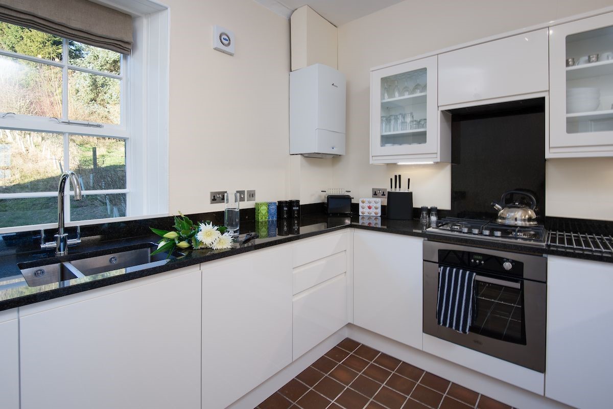 Dipper Cottage - kitchen area with monochrome colour scheme
