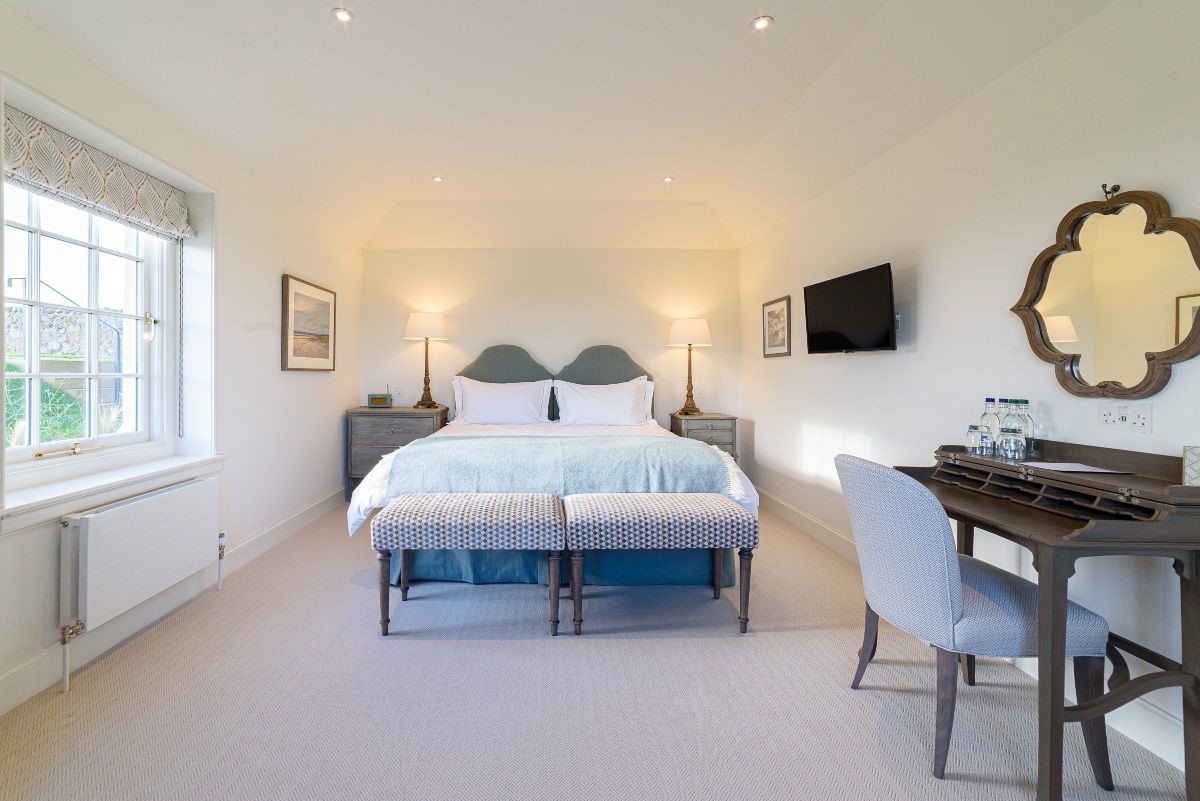 Fenton Lodge - South bedroom with zip and link beds, TV, dressing table and side tables