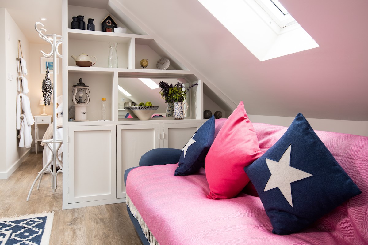 Lydia - the modern navy blue and bright pink colour scheme carries through the apartment