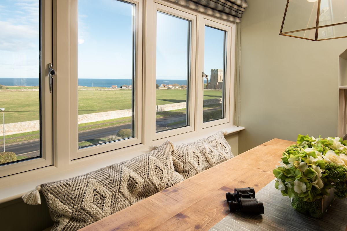 Captain's Landing - enjoy meals around the table with views of Bamburgh