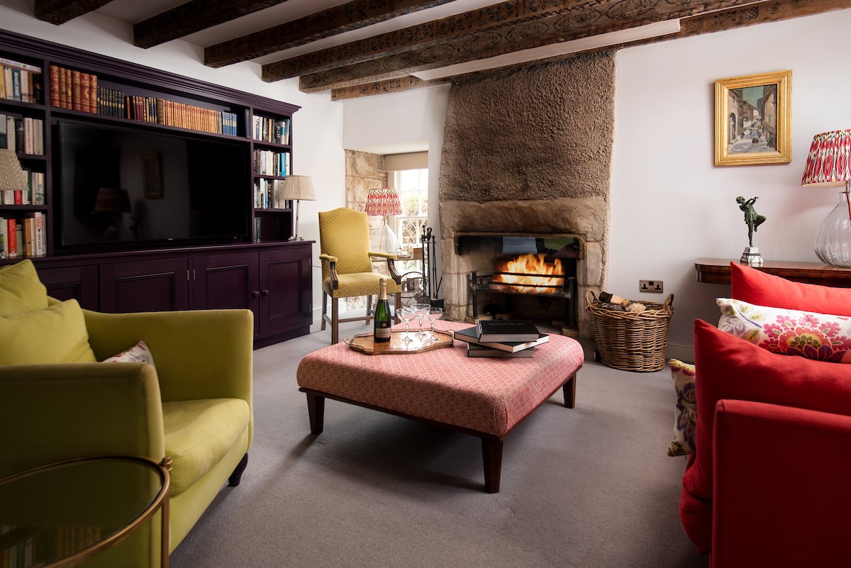 Old Purves Hall - cosy drawing room with large Smart TV and selection of books
