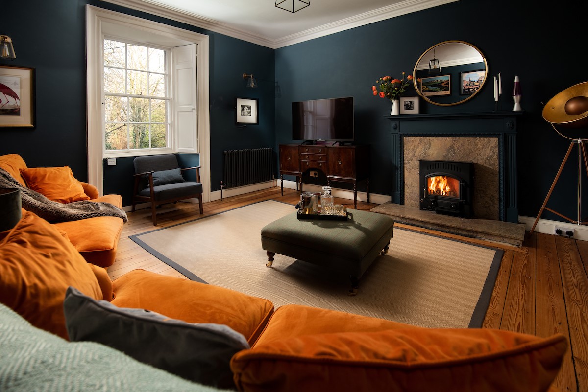 Cairnbank House - relax in front of the cosy wood burner in the sitting room while watching TV