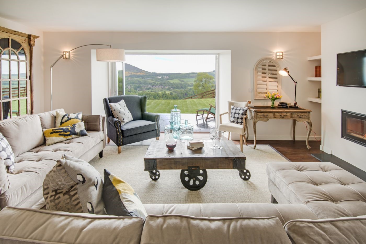 Granary - sitting room with ample seating and view of Eildon hills