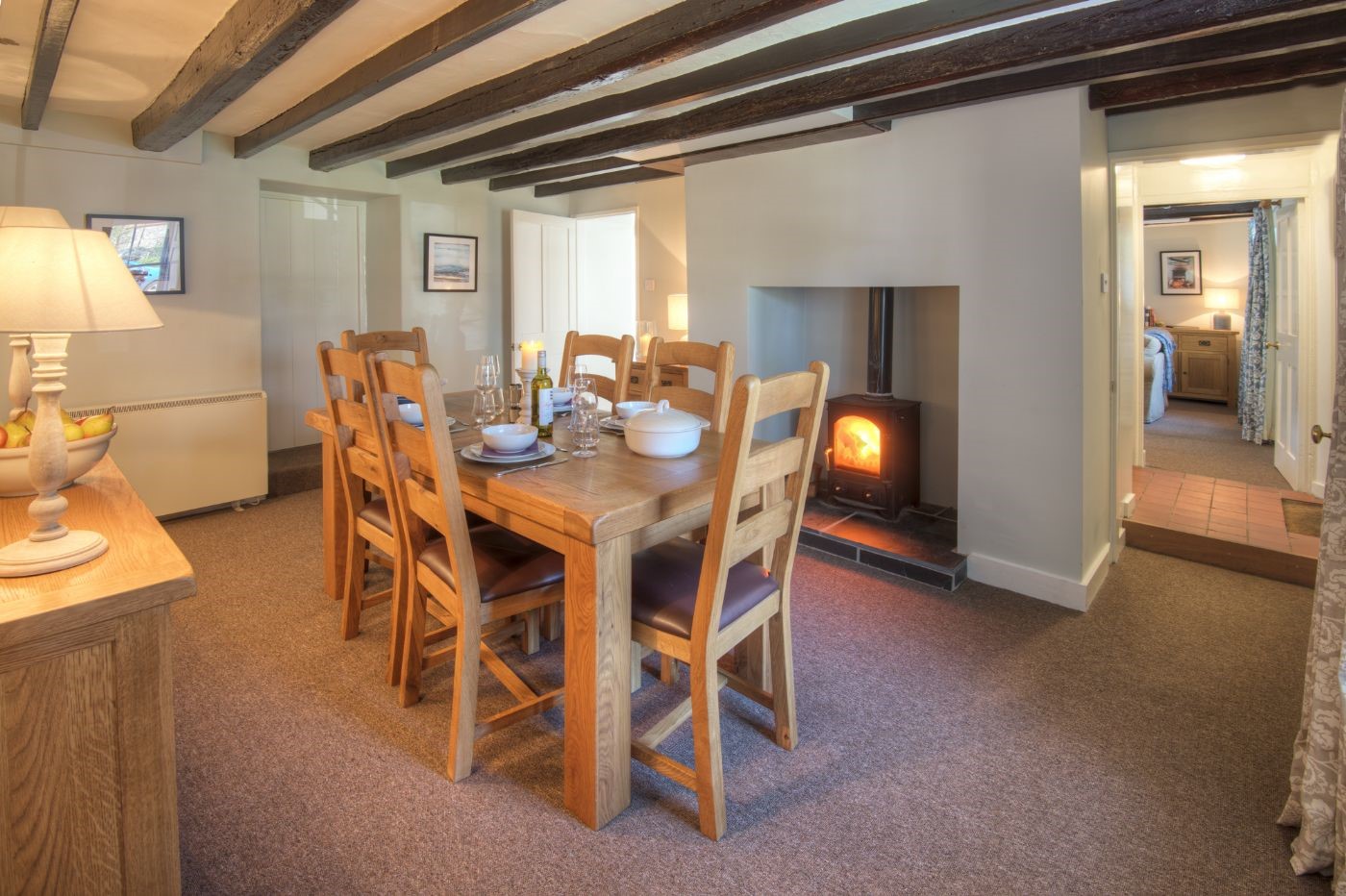 Grove House - dining room with seating for six guests and wood burning stove