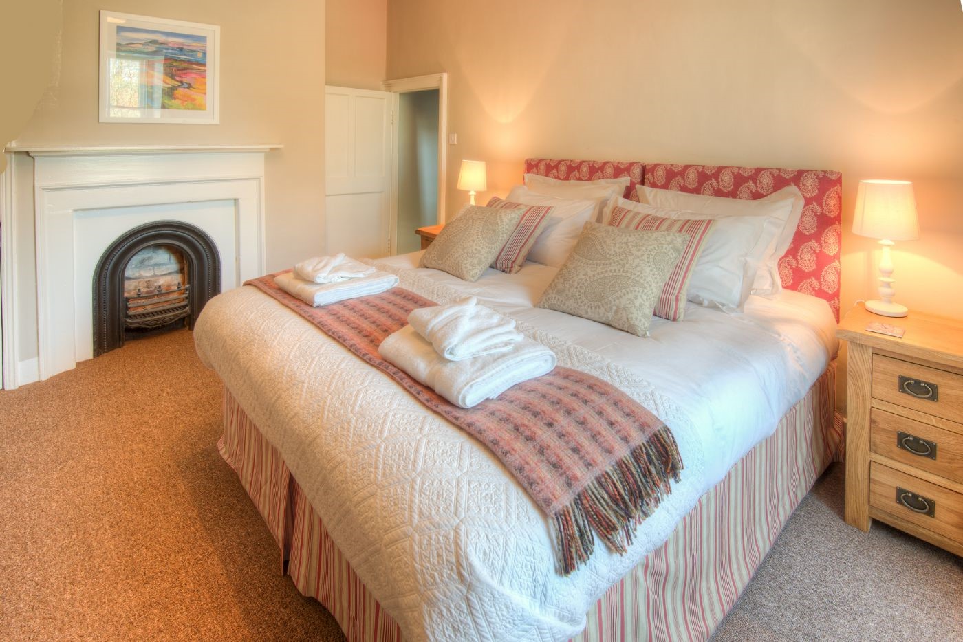 Grove House - bedroom two with zip and link beds, decorative fireplace and side tables