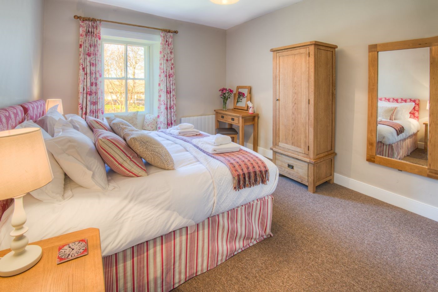Grove House - bedroom two with zip and link beds, dressing table and wardrobe