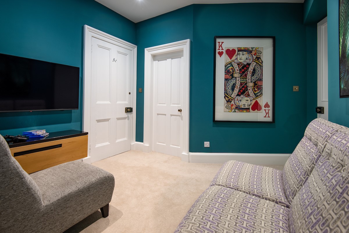 The Linen House - the snug/TV room is kitted out with a Smart TV and PS4 games console