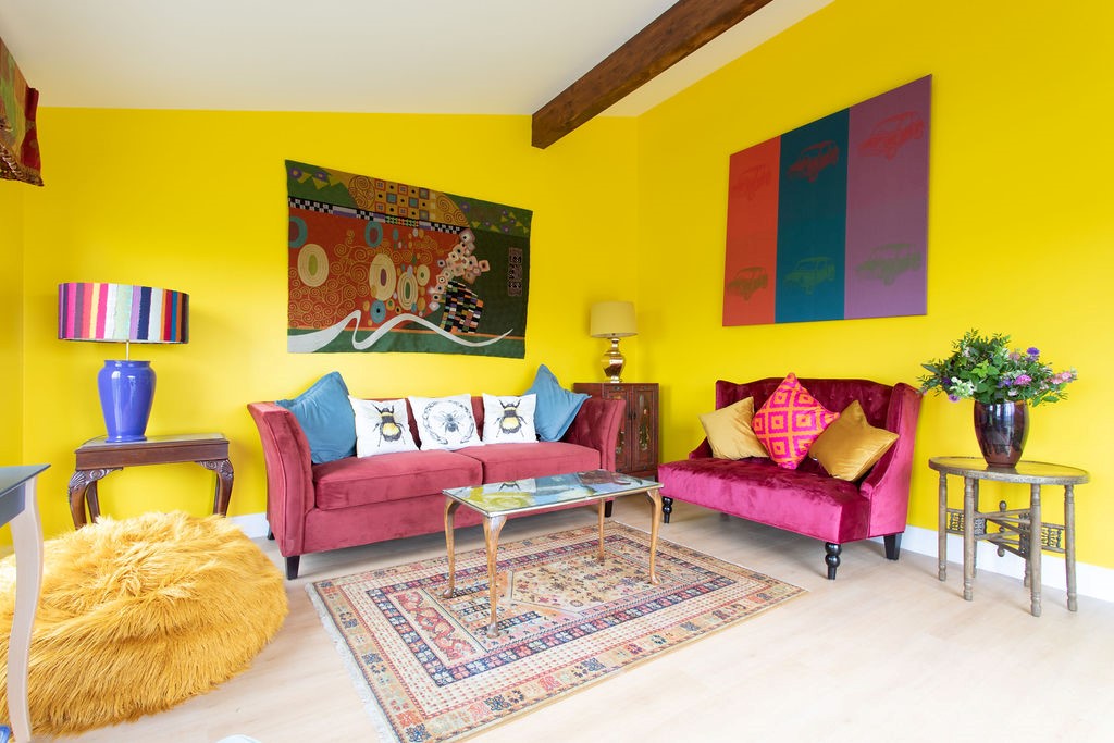 Lowtown Cottage - sun room filled with colour and artworks