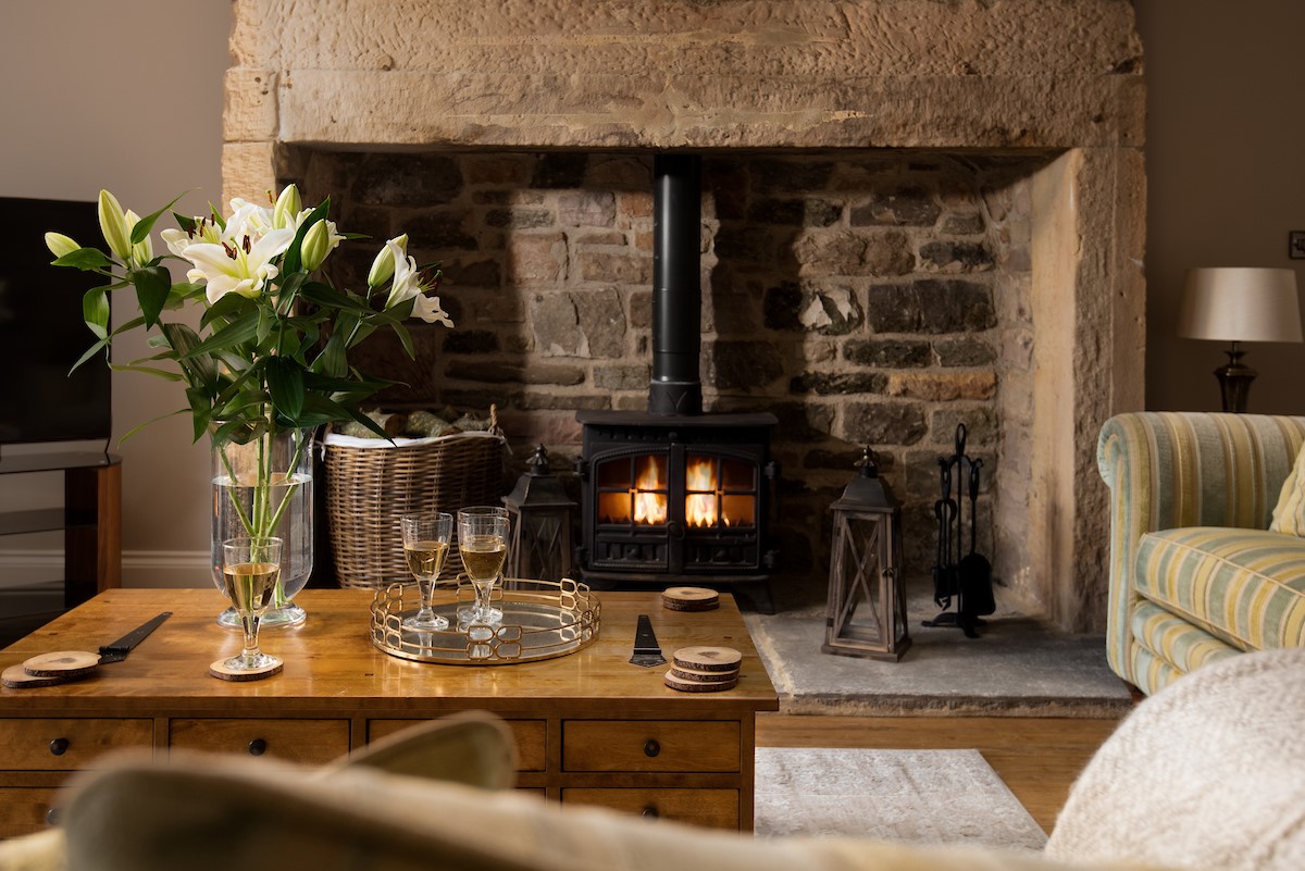 Brockmill Farmhouse - sitting room with impressive inglenook fireplace and wood-burning stove