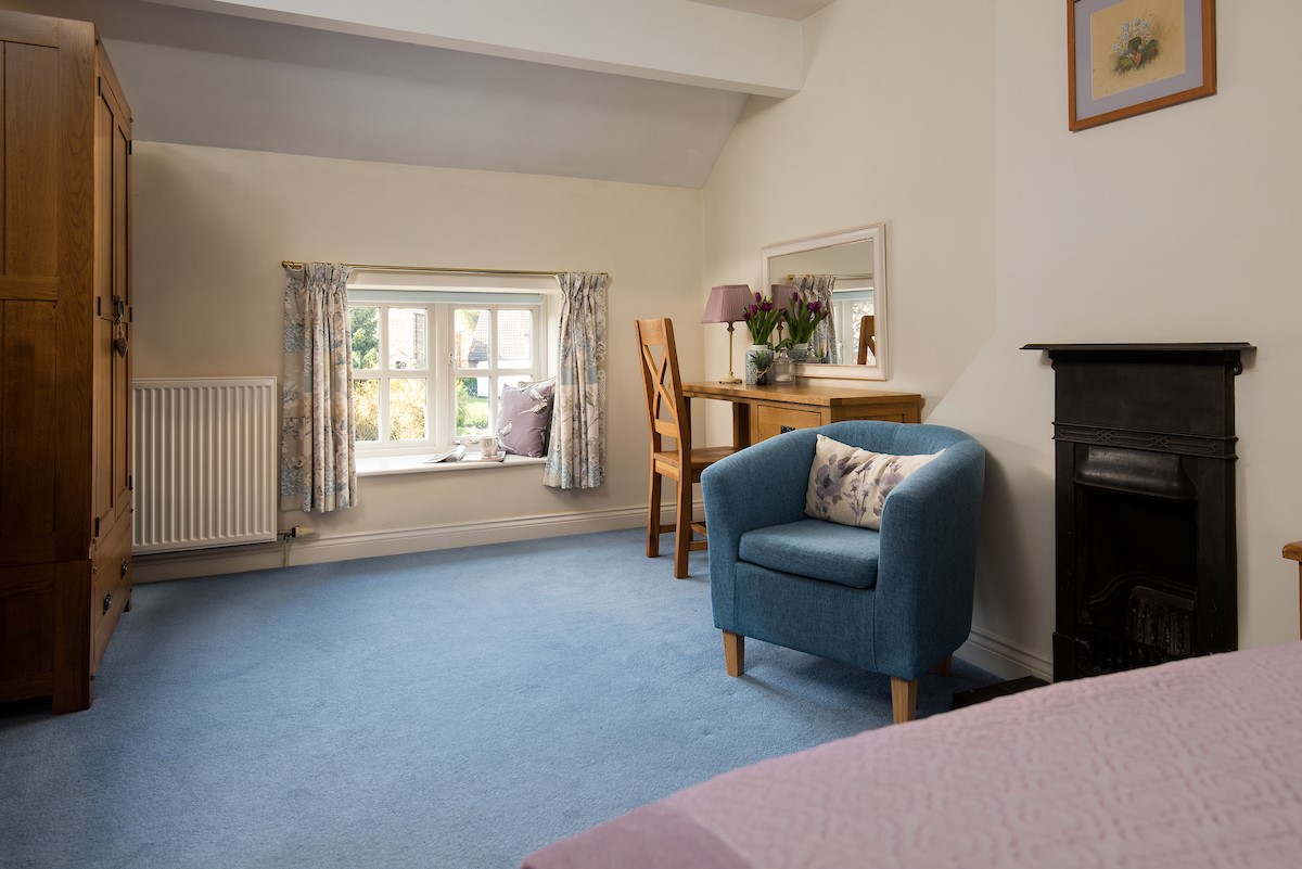 Rose Cottage, Huggate - dressing area in bedroom two with decorative fireplace