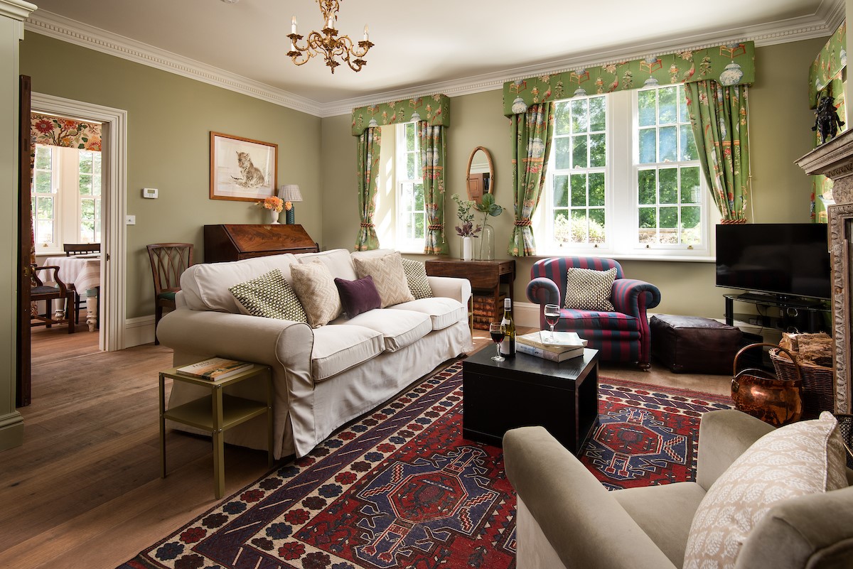 Birks Stable Cottage - cosy sitting room with comfortable seating, perfect after a day exploring