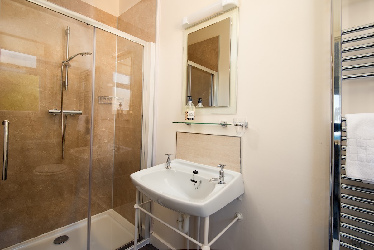 The Fairway - en-suite shower room with shower, WC, basin and heated towel rail