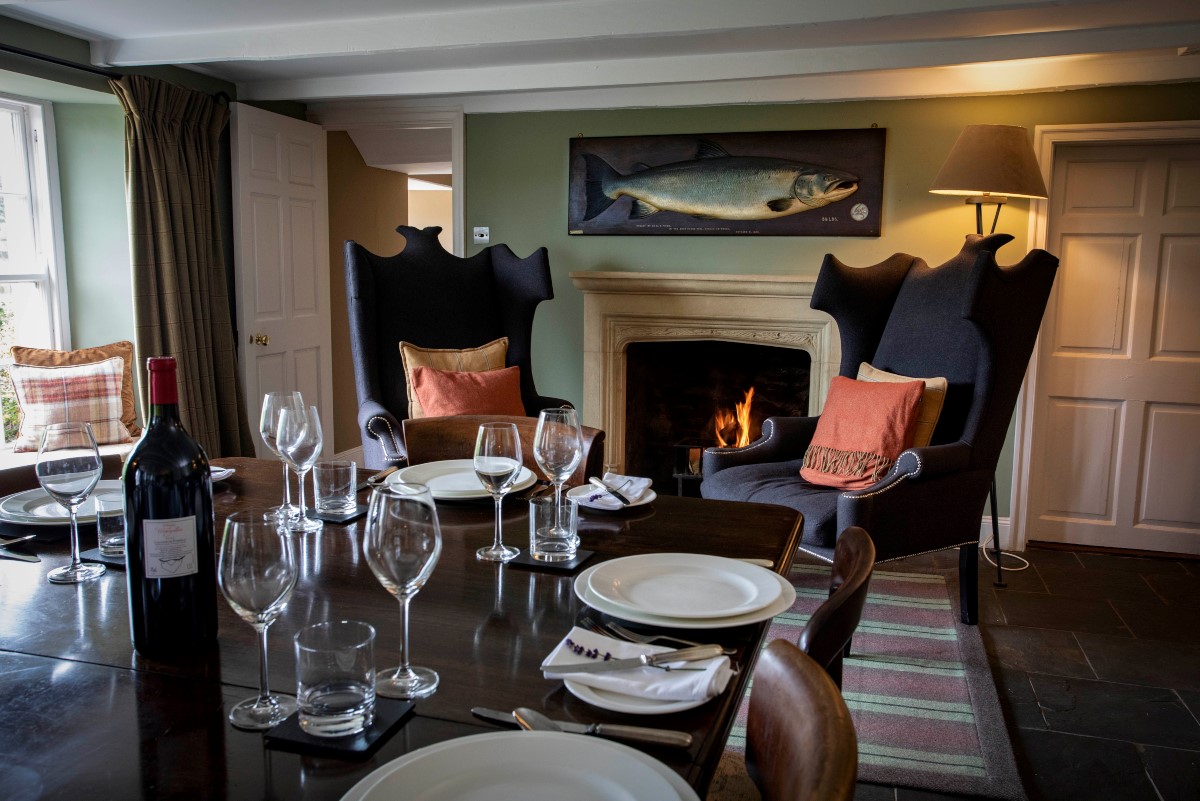 The Boathouse - the stylish chairs by the open fire in the dining room