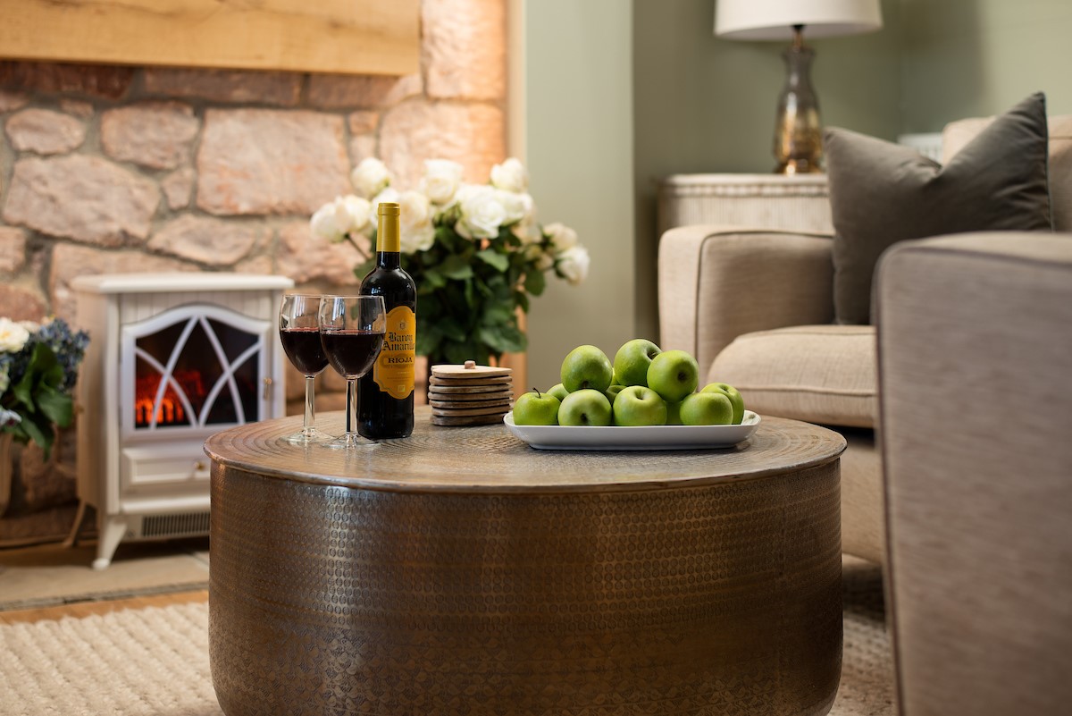 Captain's Landing - sit back and relax with a bottle of fizz in front of the electric log burner
